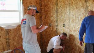 Top Shop team working on a house with Habitat for Humanity of the Mid-Ohio Valley